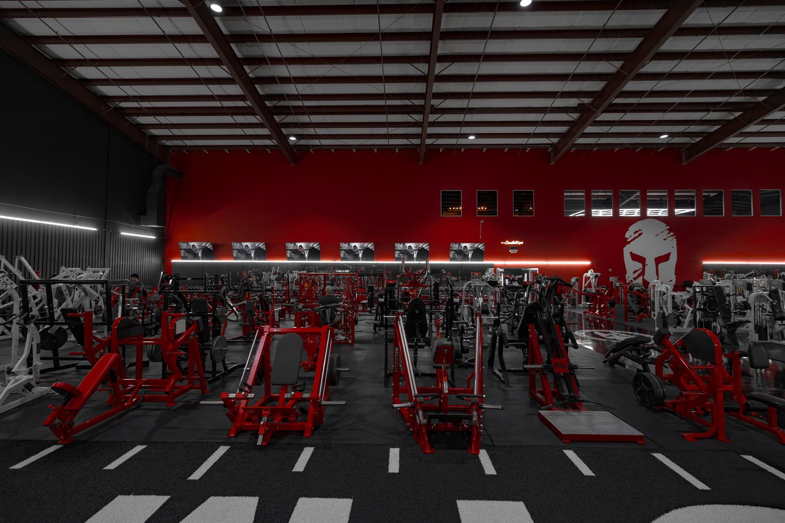 Machine rows under the red wall